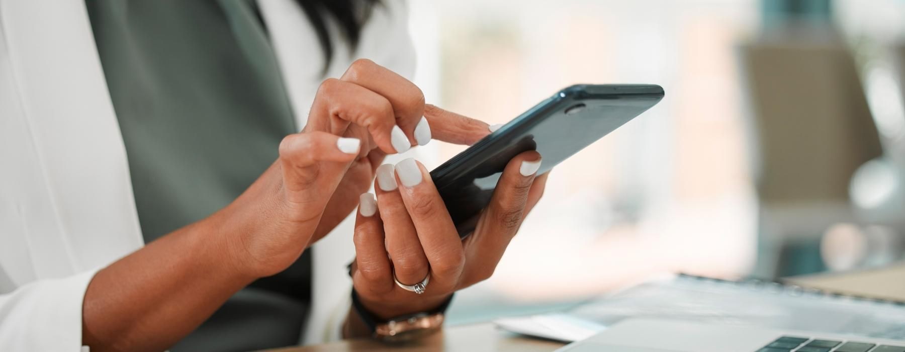 woman texts on her phone