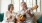 man plays the guitar for woman