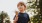 a boy holding an ice cream cone