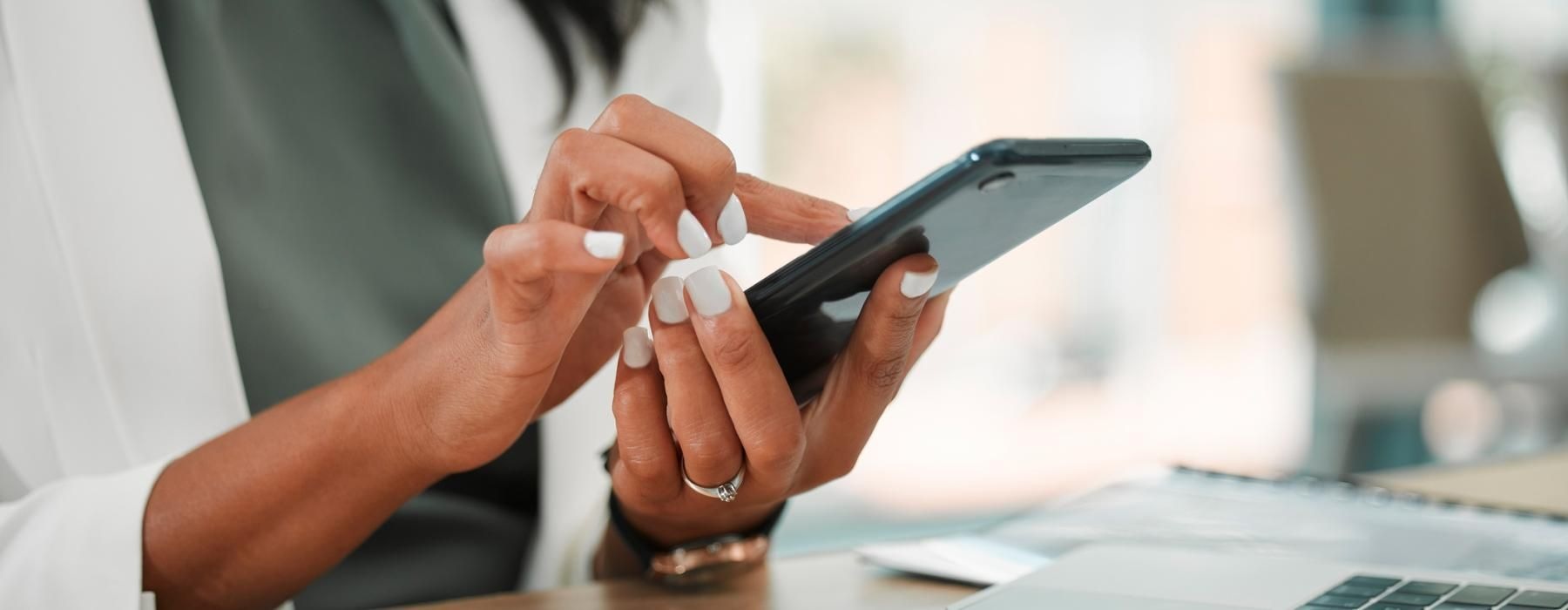 woman texts on her phone