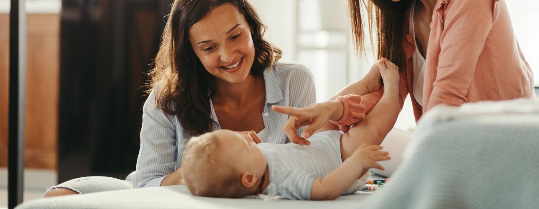women playing a baby