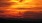a sunset over mountains