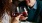 a couple of people holding wine glasses